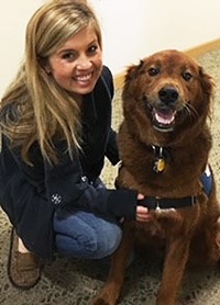 volunteer with therapy dog
